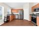Modern kitchen with stainless steel appliances, ample cabinetry, and granite countertops at 511 Porpoise Rd, Venice, FL 34293