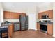 Modern kitchen with stainless steel appliances and light wood cabinetry at 511 Porpoise Rd, Venice, FL 34293