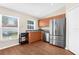 Well-lit kitchen features stainless steel appliances and wood flooring at 511 Porpoise Rd, Venice, FL 34293