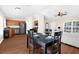 Open-concept living space with a dining table, kitchen, and cozy living area at 511 Porpoise Rd, Venice, FL 34293
