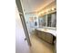 Bathroom featuring a vanity, sink, mirror, and overhead lighting, plus access to the toilet and shower at 537 Amberjack Dr, North Port, FL 34287