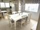 Cozy dining area with a large table, classic decor, and natural light at 537 Amberjack Dr, North Port, FL 34287