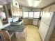 Functional kitchen with essential appliances, ample counter space, and a breakfast nook at 537 Amberjack Dr, North Port, FL 34287