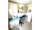 Charming home office space with built-in cabinets, desk, and beachy decorative accents at 537 Amberjack Dr, North Port, FL 34287