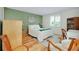 Charming bedroom with hardwood floors, a shuttered window, and a cozy rug, perfect for relaxation at 553 Circlewood Dr # T11, Venice, FL 34293