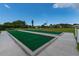 Well-maintained bocce ball court in a meticulously kept common area, perfect for outdoor recreation and community engagement at 553 Circlewood Dr # T11, Venice, FL 34293