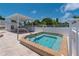 Outdoor hot tub area with lounge seating under a shaded cabana at 553 Circlewood Dr # T11, Venice, FL 34293