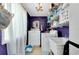 Functional laundry room with washer, dryer, utility sink, and ample storage space at 553 Circlewood Dr # T11, Venice, FL 34293