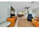 Open-concept living spaces include a modern television, dining area, and cozy seating arrangement at 553 Circlewood Dr # T11, Venice, FL 34293