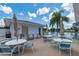 The patio offers a nice place to gather around the lake, with plenty of seating and relaxing views at 553 Circlewood Dr # T11, Venice, FL 34293