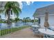 The patio features seating for all with a wonderful lake view, perfect for enjoying the Florida weather at 553 Circlewood Dr # T11, Venice, FL 34293