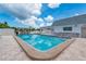 Sparkling community pool surrounded by comfortable seating and a well-maintained deck at 553 Circlewood Dr # T11, Venice, FL 34293