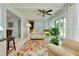 Bright sunroom with comfortable seating, tile flooring, and scenic views creating a relaxing atmosphere at 553 Circlewood Dr # T11, Venice, FL 34293