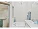Bright bathroom features a shower and a separate tub beneath a chandelier at 5641 Hidden Oak Ct, North Port, FL 34287