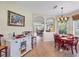 Bright dining area showcasing a stylish chandelier and seamless connection to the living room at 5641 Hidden Oak Ct, North Port, FL 34287