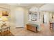 Elegant entryway featuring tile flooring, neutral walls, and arched doorways at 5641 Hidden Oak Ct, North Port, FL 34287