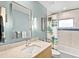 Stylish bathroom vanity with quartz countertop and tile backsplash accents the modern fixtures at 608 Apalachicola Rd, Venice, FL 34285