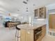Open floor plan featuring a modern kitchen with stainless steel appliances next to a dining and living area at 608 Apalachicola Rd, Venice, FL 34285