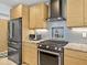 Kitchen with custom cabinets, granite countertops, stainless appliances and a tile backsplash at 608 Apalachicola Rd, Venice, FL 34285