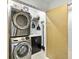 Efficient laundry area with stacked washer/dryer and convenient wash sink at 608 Apalachicola Rd, Venice, FL 34285