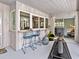 Cozy patio with bar, exercise area, and views into the home's interior at 608 Apalachicola Rd, Venice, FL 34285