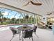 Charming patio with outdoor dining area and refreshing pool view at 608 Apalachicola Rd, Venice, FL 34285