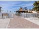 Gated beach access with bike rack and sign in a well-maintained community at 616 Gardenia Dr, Venice, FL 34285