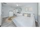 Bright bedroom boasts a comfy bed, stylish rug, and natural light, offering a serene and inviting retreat for relaxation at 616 Gardenia Dr, Venice, FL 34285