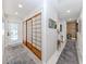Hallway with hardwood floors, and access to backyard at 616 Gardenia Dr, Venice, FL 34285
