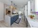 Open kitchen with a large island and modern appliances, perfect for entertaining at 616 Gardenia Dr, Venice, FL 34285