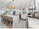 Bright kitchen showcasing white cabinetry and a stylish island with seating at 616 Gardenia Dr, Venice, FL 34285