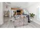 Open living room with vaulted ceilings, fireplace, hardwood floors, and modern decor at 616 Gardenia Dr, Venice, FL 34285
