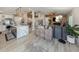 Open-concept living space featuring modern decor and a spacious kitchen view at 616 Gardenia Dr, Venice, FL 34285