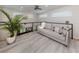 Loft area with hardwood floors, natural lighting, and comfortable seating at 616 Gardenia Dr, Venice, FL 34285