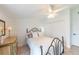 Bedroom featuring neutral walls, tiled floors, a ceiling fan and closet space at 633 White Pine Tree Rd # 27, Venice, FL 34285