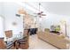 Open-concept living area with modern finishes, vaulted ceilings, and ample natural light at 633 White Pine Tree Rd # 27, Venice, FL 34285