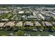 Aerial view of the community showcasing waterfront properties, docks, and convenient access to nearby amenities at 6724 Schooner Bay Cir # 6724, Sarasota, FL 34231