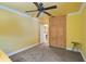 Bright bedroom featuring a ceiling fan and wooden built-in cabinets and drawers at 6724 Schooner Bay Cir # 6724, Sarasota, FL 34231