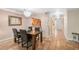 Charming dining area with tile flooring, stylish chandelier, and easy access to the adjacent kitchen at 6724 Schooner Bay Cir # 6724, Sarasota, FL 34231