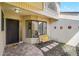 Inviting front entrance with a charming bench, a decorative door, and landscaped accents enhance curb appeal at 6724 Schooner Bay Cir # 6724, Sarasota, FL 34231