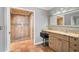 Main bathroom features walk-in shower, granite countertop vanity, and tile flooring at 6724 Schooner Bay Cir # 6724, Sarasota, FL 34231