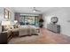 Bright main bedroom with tile flooring, access to lanai, and stylish furniture at 6724 Schooner Bay Cir # 6724, Sarasota, FL 34231