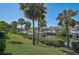 Waterfront view showing the canal and the home's setting with lush greenery at 6724 Schooner Bay Cir # 6724, Sarasota, FL 34231