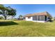 Charming home with a large backyard and screened patio area, perfect for outdoor entertaining at 680 Circlewood Dr # W3, Venice, FL 34293