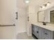 Updated bathroom features modern vanity with storage, and tile flooring at 680 Circlewood Dr # W3, Venice, FL 34293