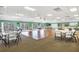 Spacious room in the clubhouse, featuring a large dance floor and ample seating at 680 Circlewood Dr # W3, Venice, FL 34293