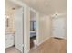 Bright foyer features new flooring, and leads to a bathroom and bedroom at 680 Circlewood Dr # W3, Venice, FL 34293