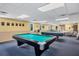Relax in the game room, featuring pool tables and comfortable seating at 680 Circlewood Dr # W3, Venice, FL 34293