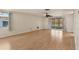 Bright and airy living room featuring hardwood floors and sliding doors to a screened in patio at 680 Circlewood Dr # W3, Venice, FL 34293