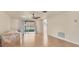 Bright living room with hardwood floors and sliding doors to a screened in patio at 680 Circlewood Dr # W3, Venice, FL 34293